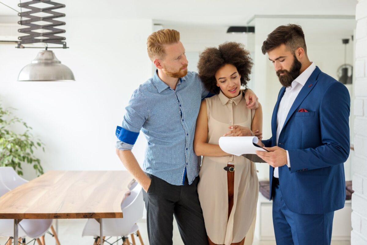 couple with real estate agent.